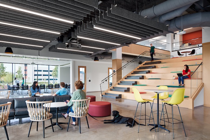 The headquarters is designed to inspire a connection to the outdoors with floor-to-ceiling glass windows and outdoor meeting spaces