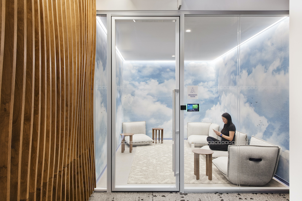 a meditation room with cloud wallpaper