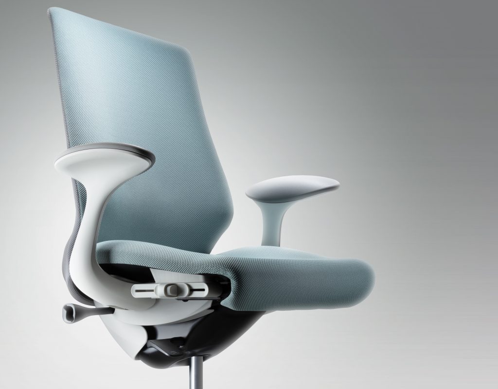 close up shot of a light blue chair with gray arm rests slightly facing right
