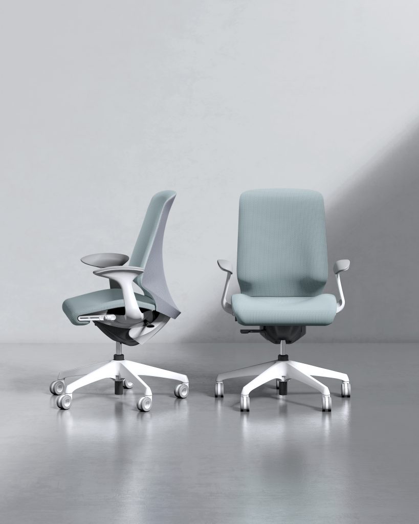 two teal chairs facing different directions