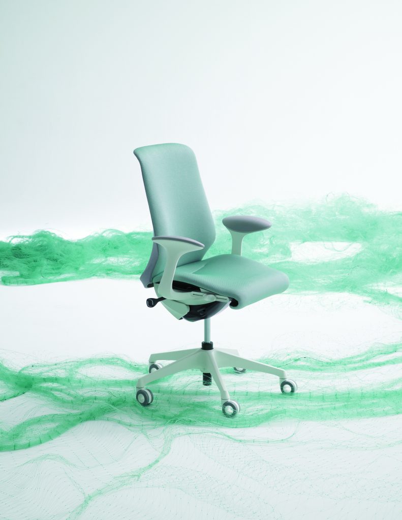 teal chair turn slightly to the right with teal smoke moving past it